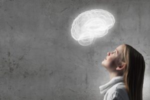 side-view-of-girl-of-school-age-looking-at-brain